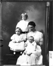 Group portrait of Mrs. Young with children 1910
