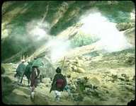 Japanese people in local attire hiking through mountains.