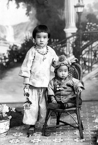 [Portrait of young Chinese girl and toddler]