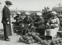 Mine net workers wiring the floats together