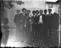 Group of young men in back of building n.d.
