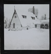 Winter-time view of TarvaspÃ¤Ã¤, photographed from the south-west. The picture features the building's roofs and its characteristic central tower and entrance archway