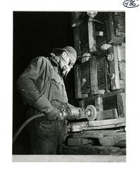 Man using a grinding wheel