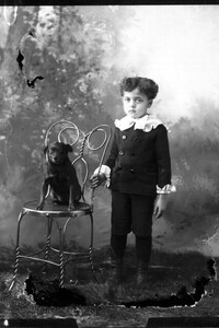 Portrait photograph of young boy and dog 1897