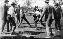 Two men having a bare knuckle fight over an altercation that took place the night before at the ball that was held after the Reids Flat race meeting - Reids Flat, NSW, c. 1925 by Jack English