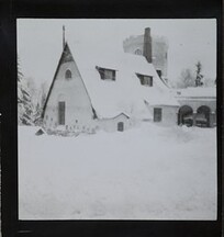 Winter-time view of TarvaspÃ¤Ã¤, photographed from the south-west. The picture features the building's roofs and its characteristic central tower and entrance archway