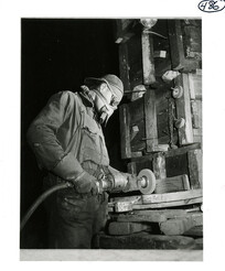 Man using a grinding wheel