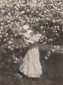 Woman holding child and blossoms , 1911