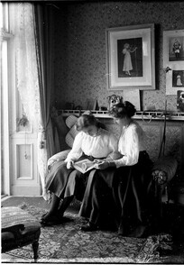 Lady Honor and Lady Morvyth Ward reading, Government House, Sydney, by A.J. Perier, 1908-1911