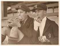 Schoolboy fans eat cake, c. 1930, by Sam Hood