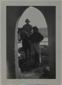 Kirsti Gallen-Kallela with Jerry at the Gallen-KallelasÂ´ gate in Taos, New Mexico, ca.1925.