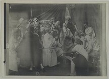 People playing a scene or posing at a studio party at AcadÃ©mie Julian in Paris, in the 1880Â´s.