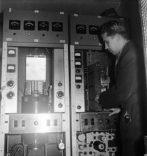 Television transmitter is being installed into the Helsinki Olympic stadium tower, 22.1.1957