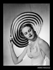 Woman modelling a hat, 1949