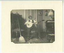 African American youth playing banjo