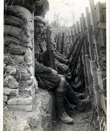 Highlanders and Dogras in a trench with dugouts [Fauquissart, France]. Photographer: H. D. Girdwood.
