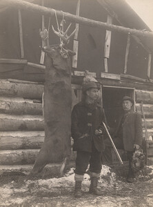 Hanging deer with hunters, 1911