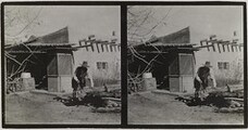 Akseli Gallen-Kallela sawing a trunk at the Gallen-KallelasÂ´ house in Taos, New Mexico, ca.1925.