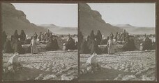 Arab women weep by the graves near the pyramids in late 1910.