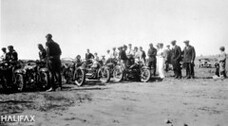 Motorcycles and spectators at an unidentified location