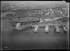 Millers Point looking east, showing construction of southern approach of the Sydney Harbour Bridge, 1929-1932, Milton Ken