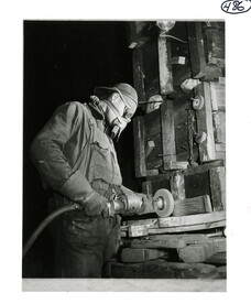 Man using a grinding wheel