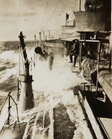 HMAS Sydney ploughing through a rough sea