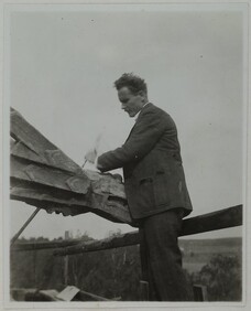 Alpo Sailo at TarvaspÃ¤Ã¤Â´s tower working on a dragon-shaped gargoyle, 1927.