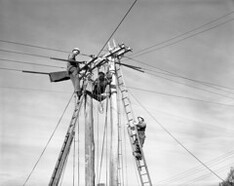 Hydro Electric Commission (H.E.C.) linemen maintaining electrical services, corner Bathurst and Barrack Streets (c1969)