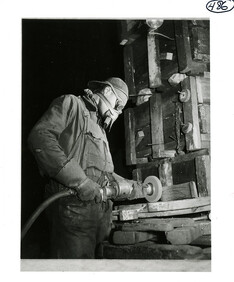 Man using a grinding wheel