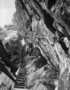 Guest on Iron Staircase up Mazinaw Rock - Bon Echo Inn