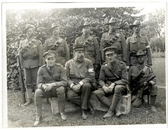 Group of six officers & men 1/4th Gurkhas who have received honours or been mentioned in dispatches in this war, with a French Red Cross surgeon who was till recently a prisoner in German [Le Sart, France]. Photographer: H. D. Girdwood.