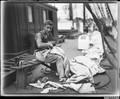 Crew member on deck preparing sails, MAGDALENE VINNEN