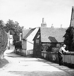 "Elderly man at fence: A summer afternoon in Surrey" is Shere near Guildford