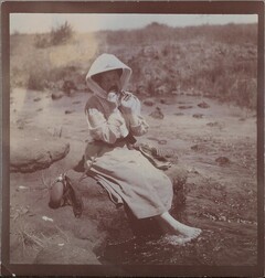 Mary Gallen-Kallela bathing her feet in the river.