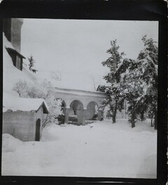 South-west view of TarvaspÃ¤Ã¤ during the winter, featuring the building's west-facing roof and archway