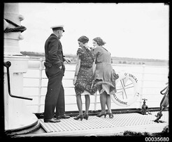 Two women and a ship's officer on the deck of SS ORUNGAL, c 1930