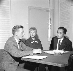 Reporter of the Finnish Broadcasting Company Esko Tommola interviews Armi Hilario (former Armi Kuusela) and her husband Gil Hilario in a radio studio.