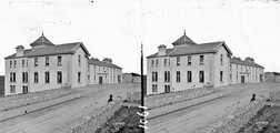 Modern building, possibly an hotel with "Butler" shop attached (is Lisdoonvarna)