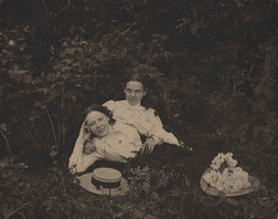 Two young women and hats, date unknown