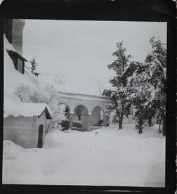 South-west view of TarvaspÃ¤Ã¤ during the winter, featuring the building's west-facing roof and archway