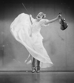 Studio photo of dancer with violin, 31 March 1939