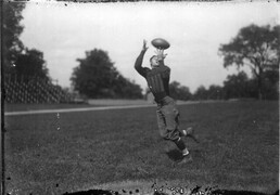 Miami University football player receiving pass n.d.