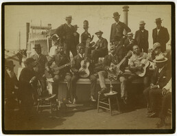 African American minstrel group performing on a riverboat