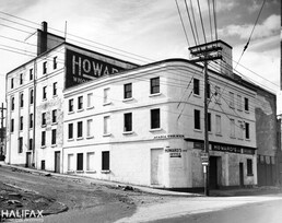 Photo of Howard's Ltd. Building, south & east sides, corner of Belle Lane and Upper Water St., now Cogswell St. Interchange