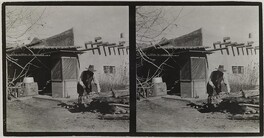 Akseli Gallen-Kallela sawing a trunk at the Gallen-KallelasÂ´ house in Taos, New Mexico, ca.1925.