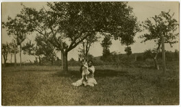 African American woman holding a dog