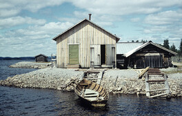 Boathouses by lake TisjÃ¶n, Dalarna, Sweden