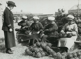 Mine net workers wiring the floats together