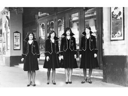 Usherettes standing in the doorway of the New Strand Theatre, Liverpool Street, Hobart (1929-30)